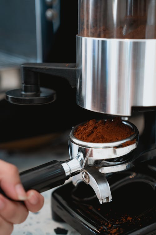 Photo of Person Getting Coffee Powder