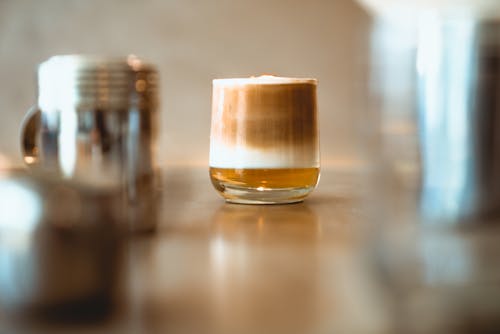 A Clear Drinking Glass With Brown Liquid