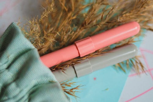 Pink and Gray Pen in Close Up Photography