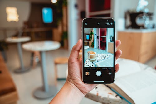 Free Photo of Person Holding Black Mobile Phone Stock Photo