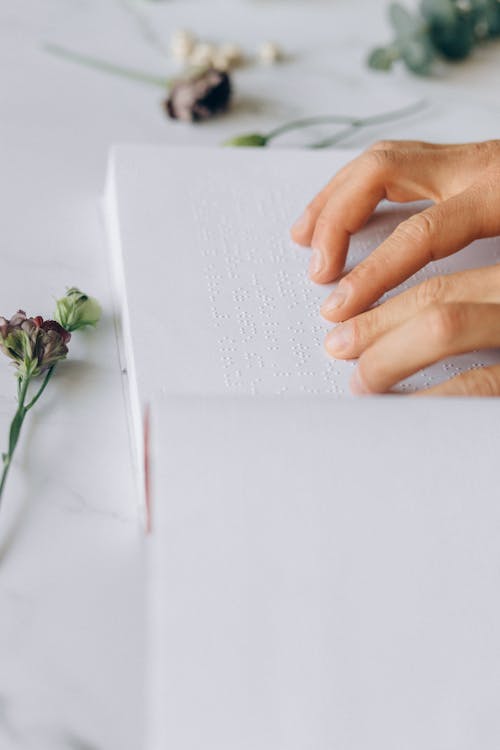Free Close-Up Photo of a Person Reading Braille Stock Photo
