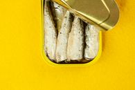 Canned fish in yellow container
