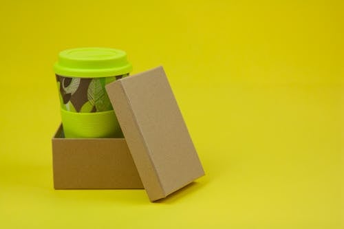 Paper cup in cardboard box