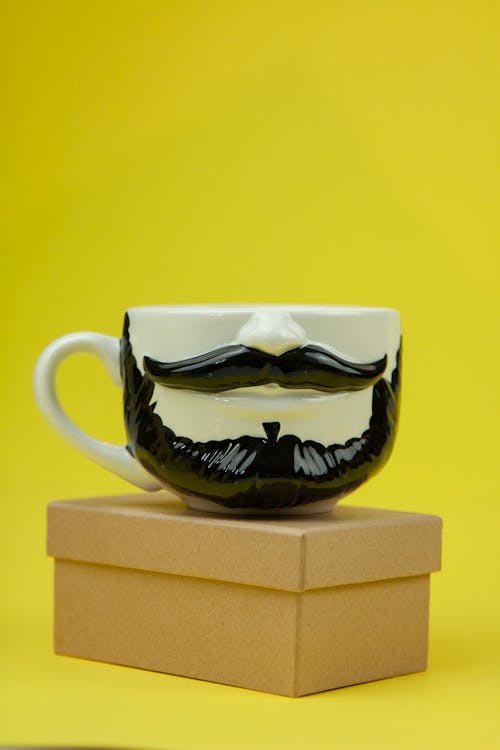 Cup with image of male jaw with beard and mustache