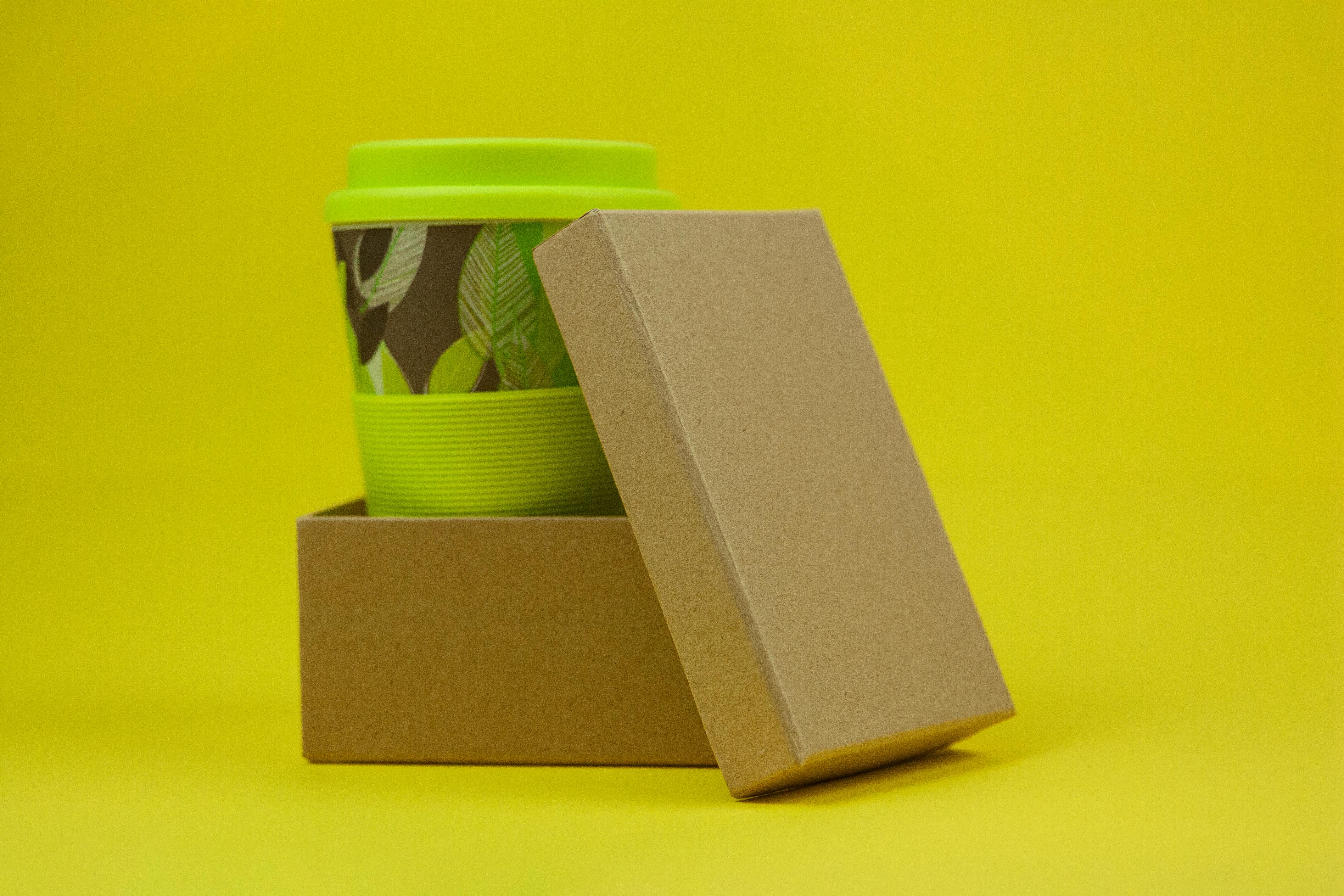 Crop woman showing paper cup · Free Stock Photo