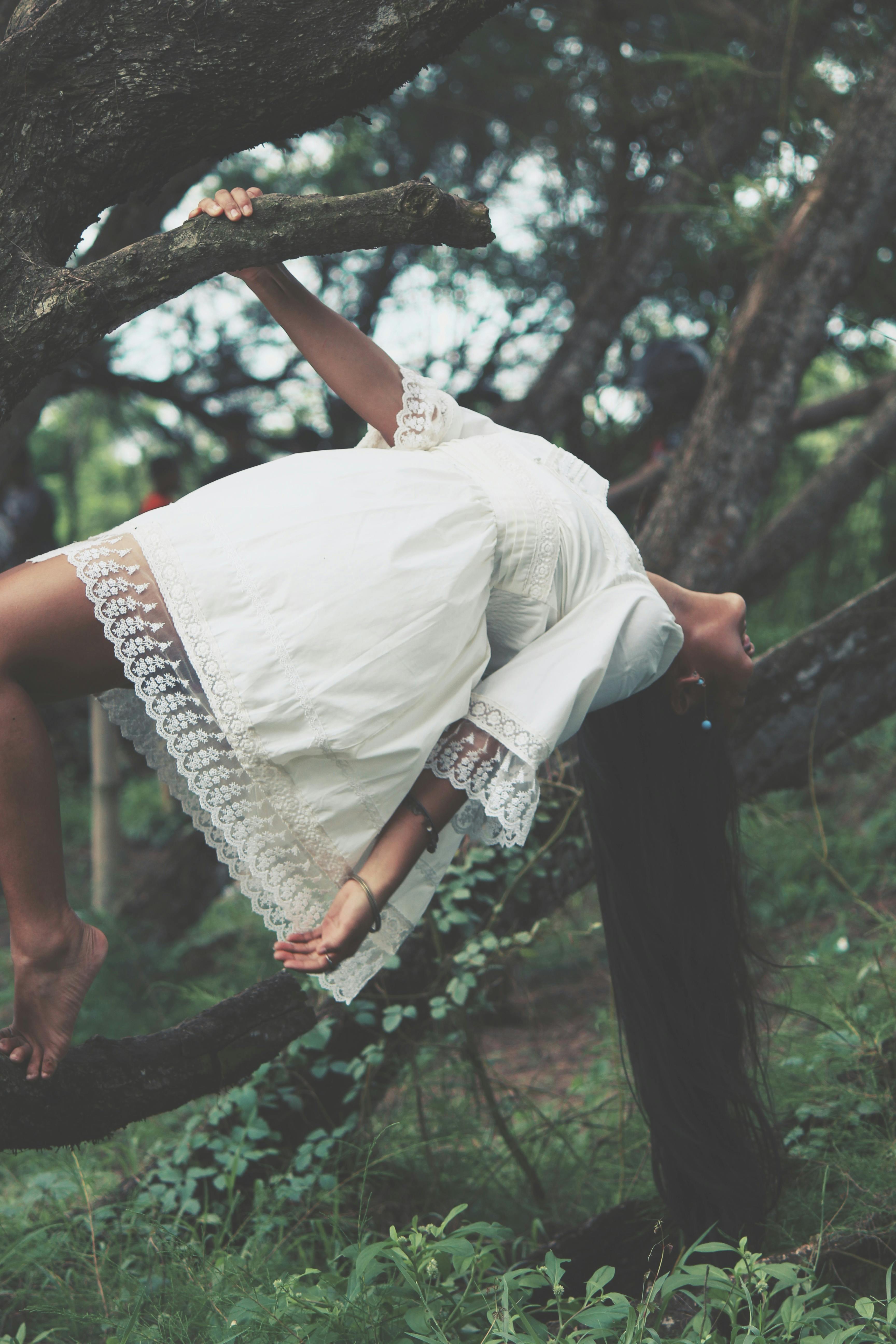 photo of woman wearing white dress