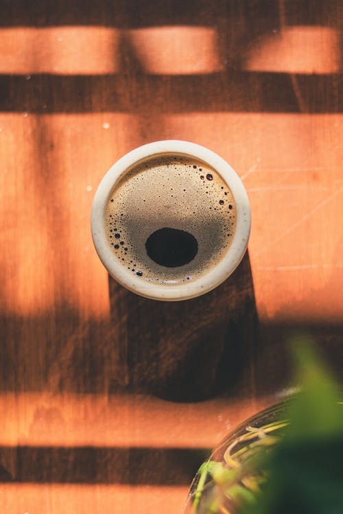 Free Photo of Cup of Coffee on Top of Wooden Surface Stock Photo
