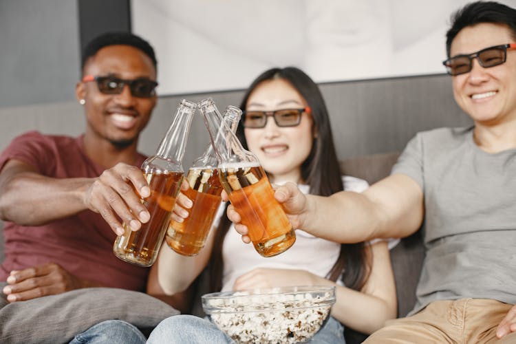 Friends Clinking Beer Bottles