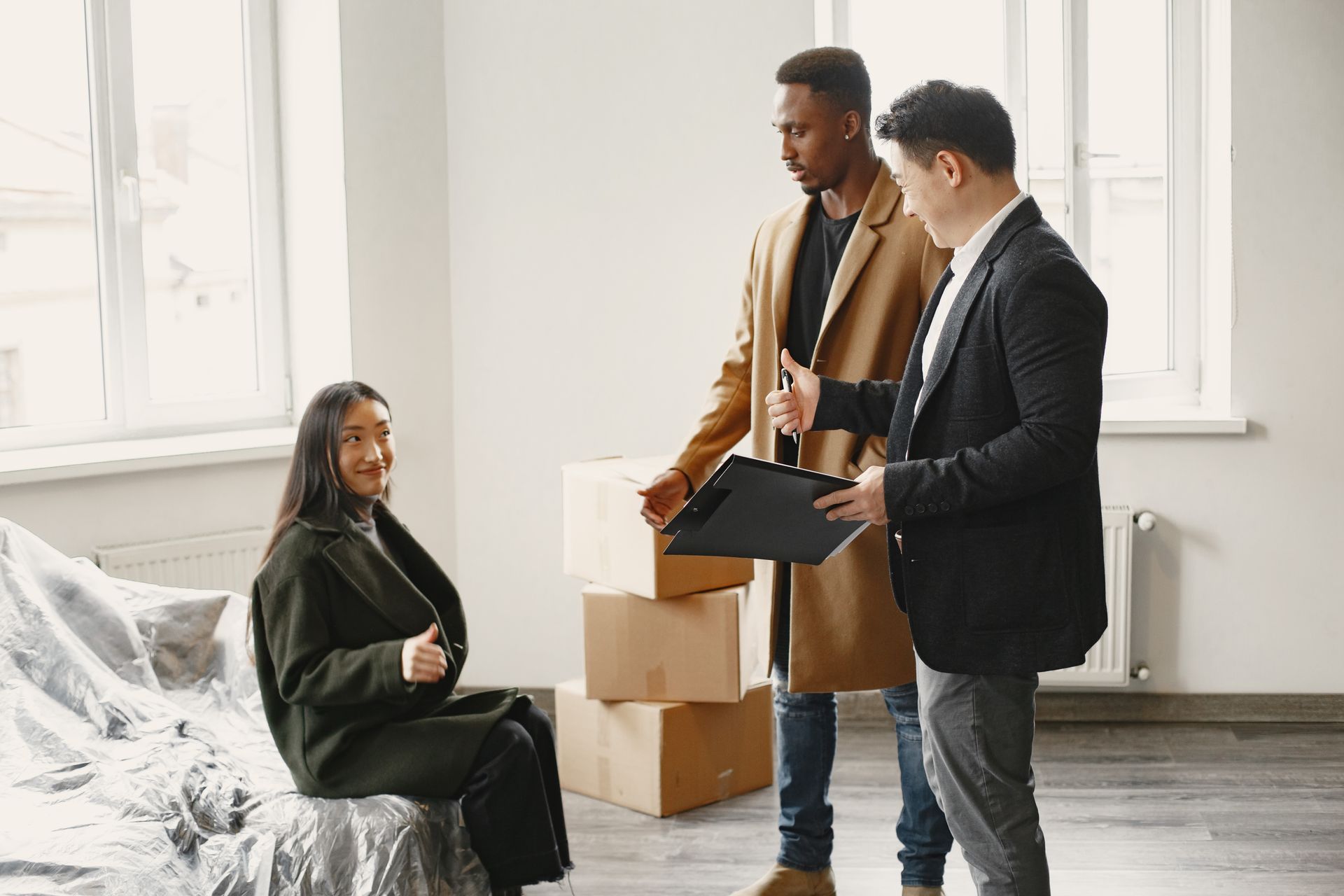 Young adults reviewing apartment options in a bright, modern setting.