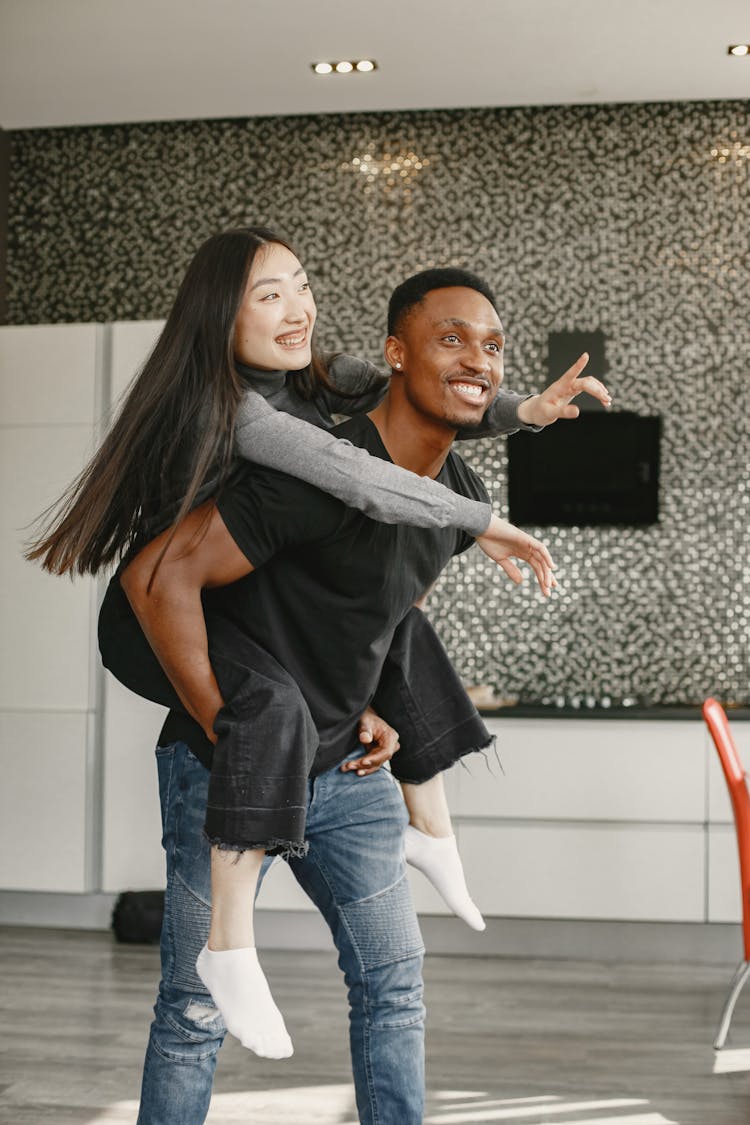 Man Piggyback Carrying His Girlfriend