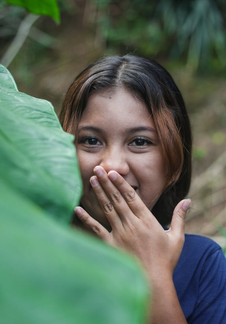 A Woman Covering Her Mouth