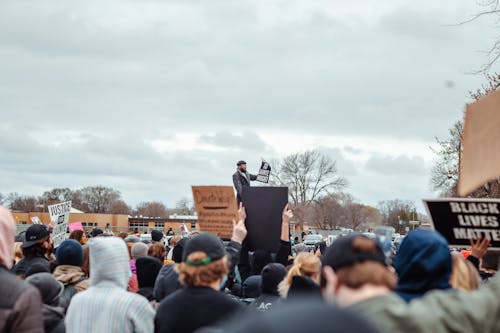 Protesters on the Street while Holding Banners