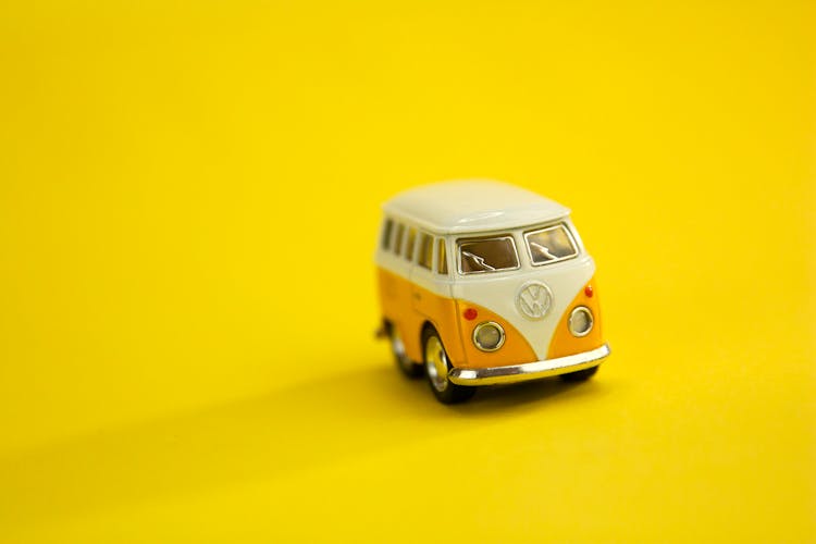 Little Toy Car On Yellow Background