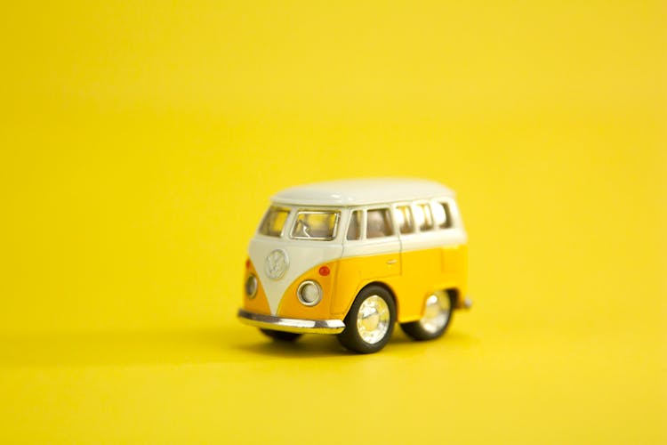 Yellow Retro Van Toy On Yellow Surface