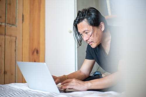 A Man Using a Laptop