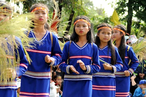 Group of Women in Blue and Red Traditional Dress