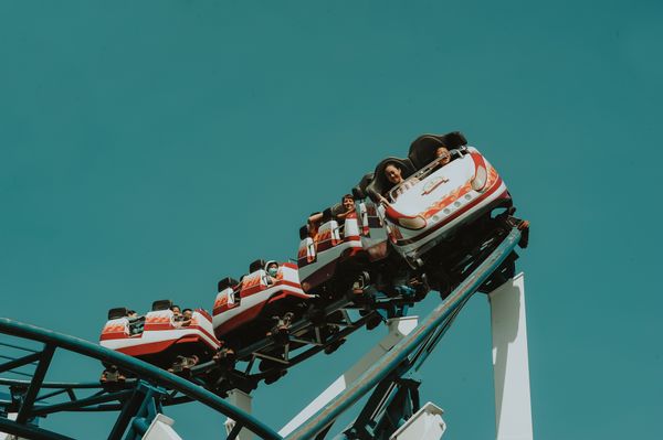Roller coaster at a theme park under a blue sky