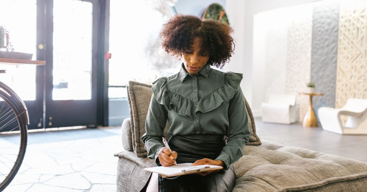 Writing Lady A Woman Writing on a Clipboard · Free Stock Photo