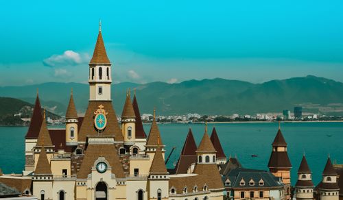 Free A charming castle-style architecture with spires set against the backdrop of Nha Trang Bay, Vietnam. Stock Photo