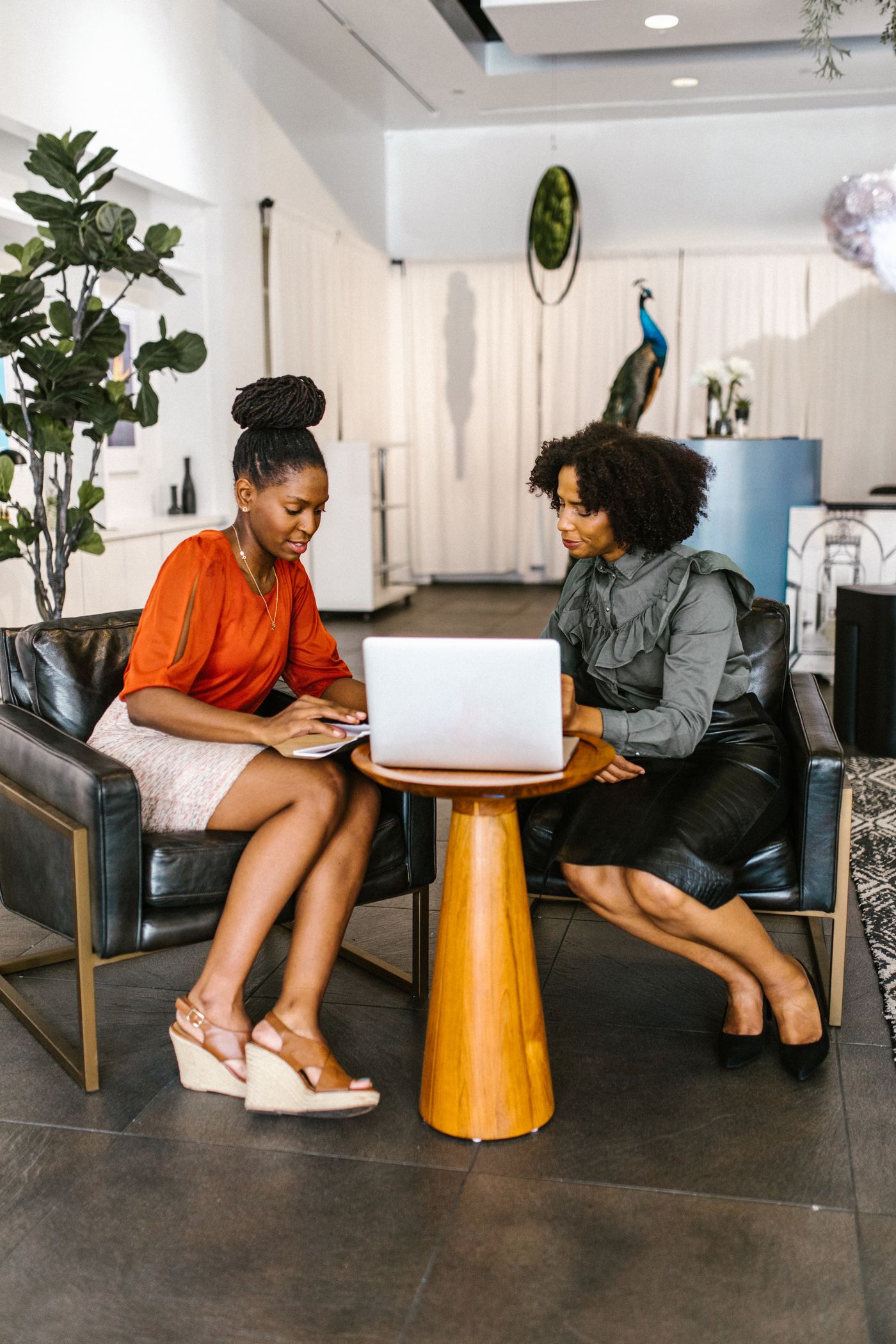 Black women collaborating during a mentorship and coaching session