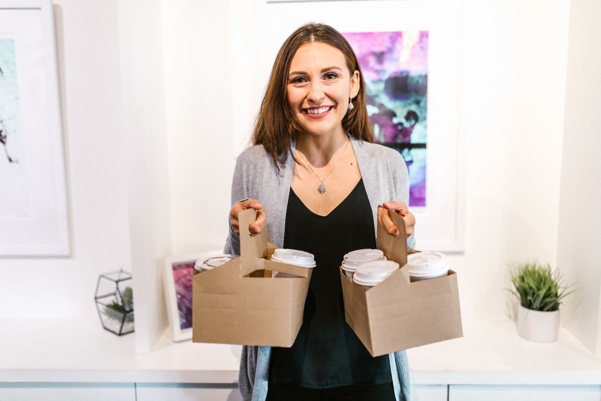 A Woman Carrying Cups of Coffee
