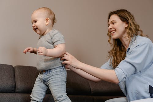 Free Happy Mother Guiding her Child Stock Photo