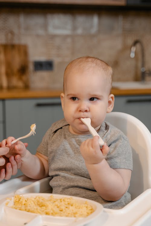 Close Photo of Baby Eating Meal