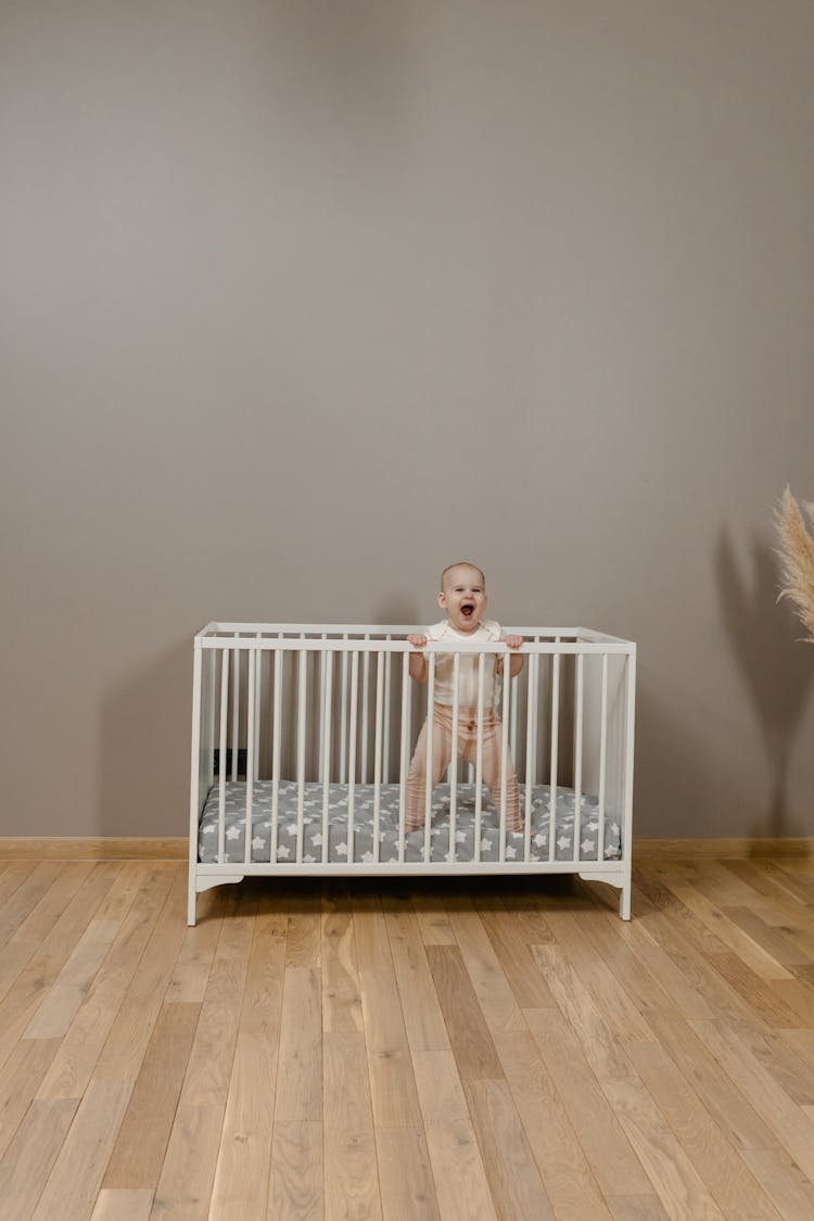 Baby In White Crib