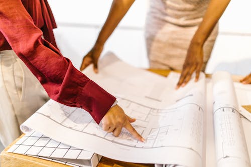 Free Women Looking at a Floor Plan  Stock Photo