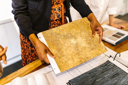 Business team evaluating design samples in a modern office setting.