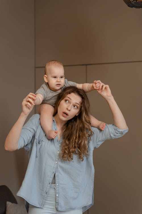 Free Mother Carrying her Baby Stock Photo
