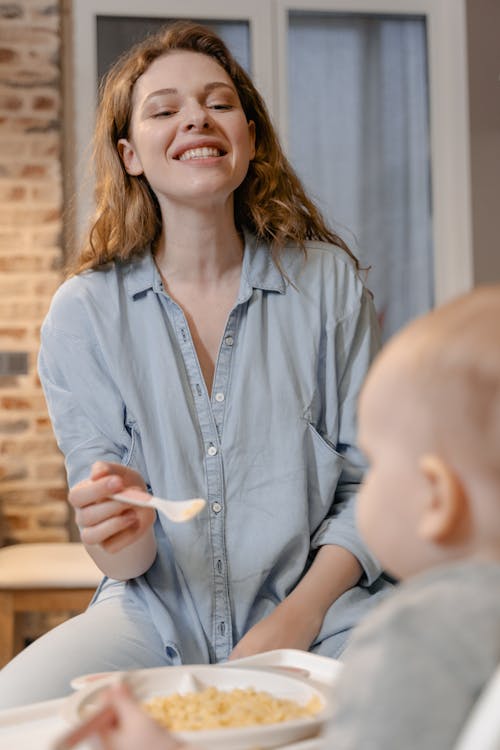 Free Mother Feeding her Baby Stock Photo