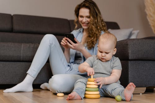 Child Playing Toys on the Ground