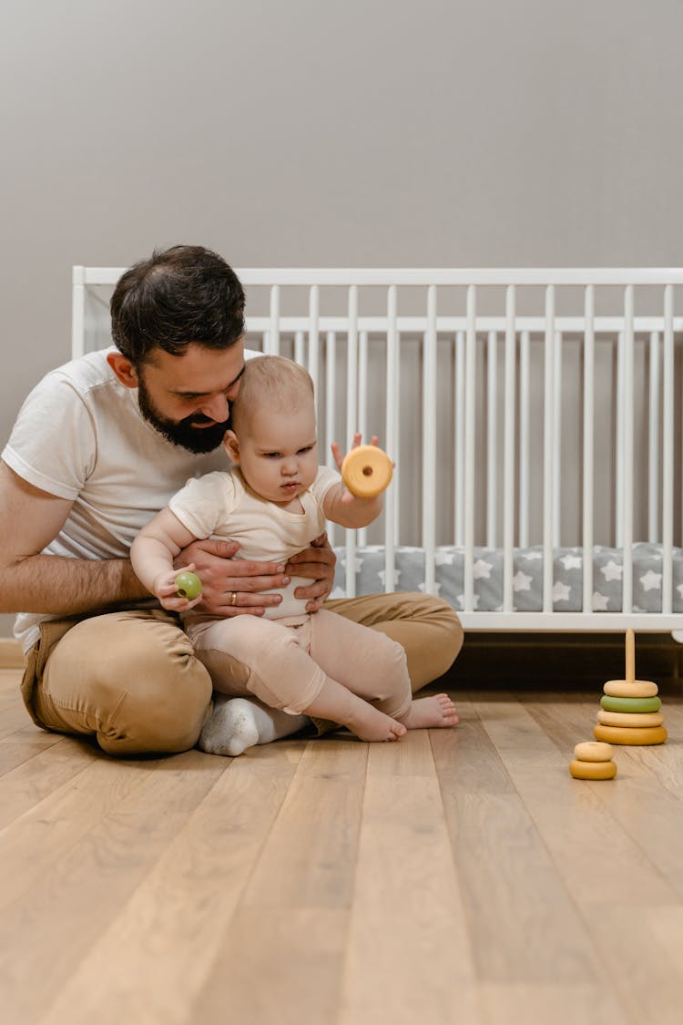 A Man Playing With His Baby