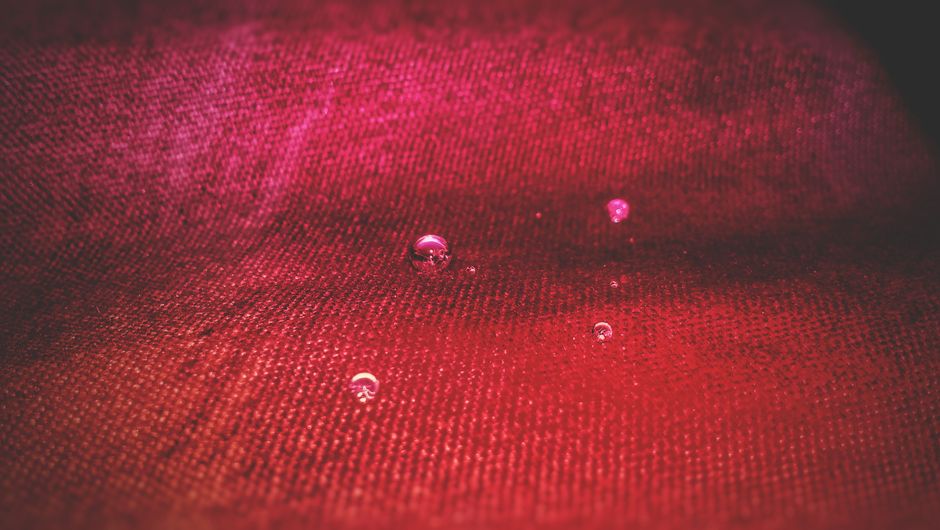 Red Translucent Die on Top of Black Surface · Free Stock Photo