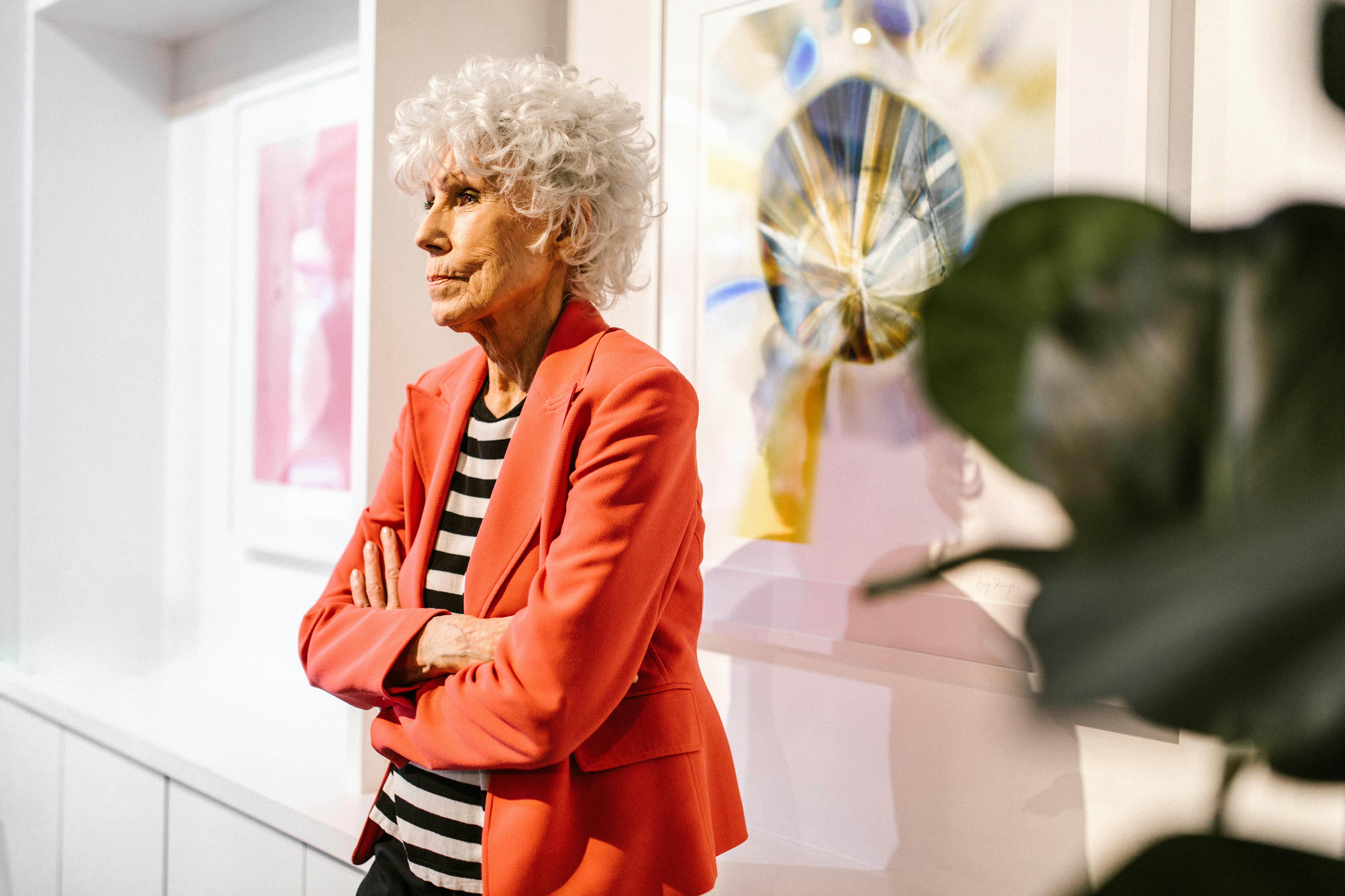 woman in red blazer standing