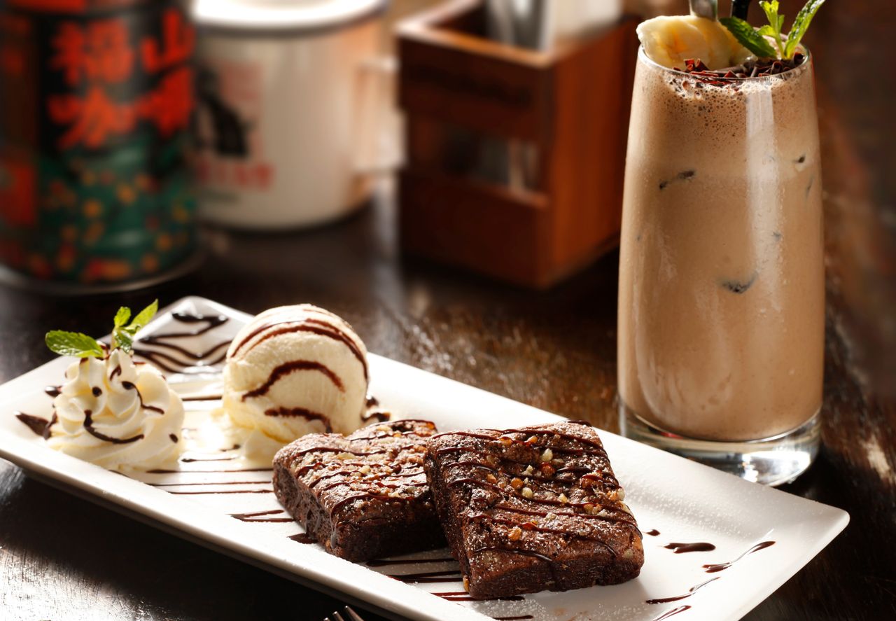 indulge in rich brownies with ice cream and iced coffee a perfect dess