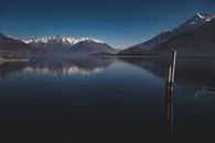 Calm river against snowy mountains