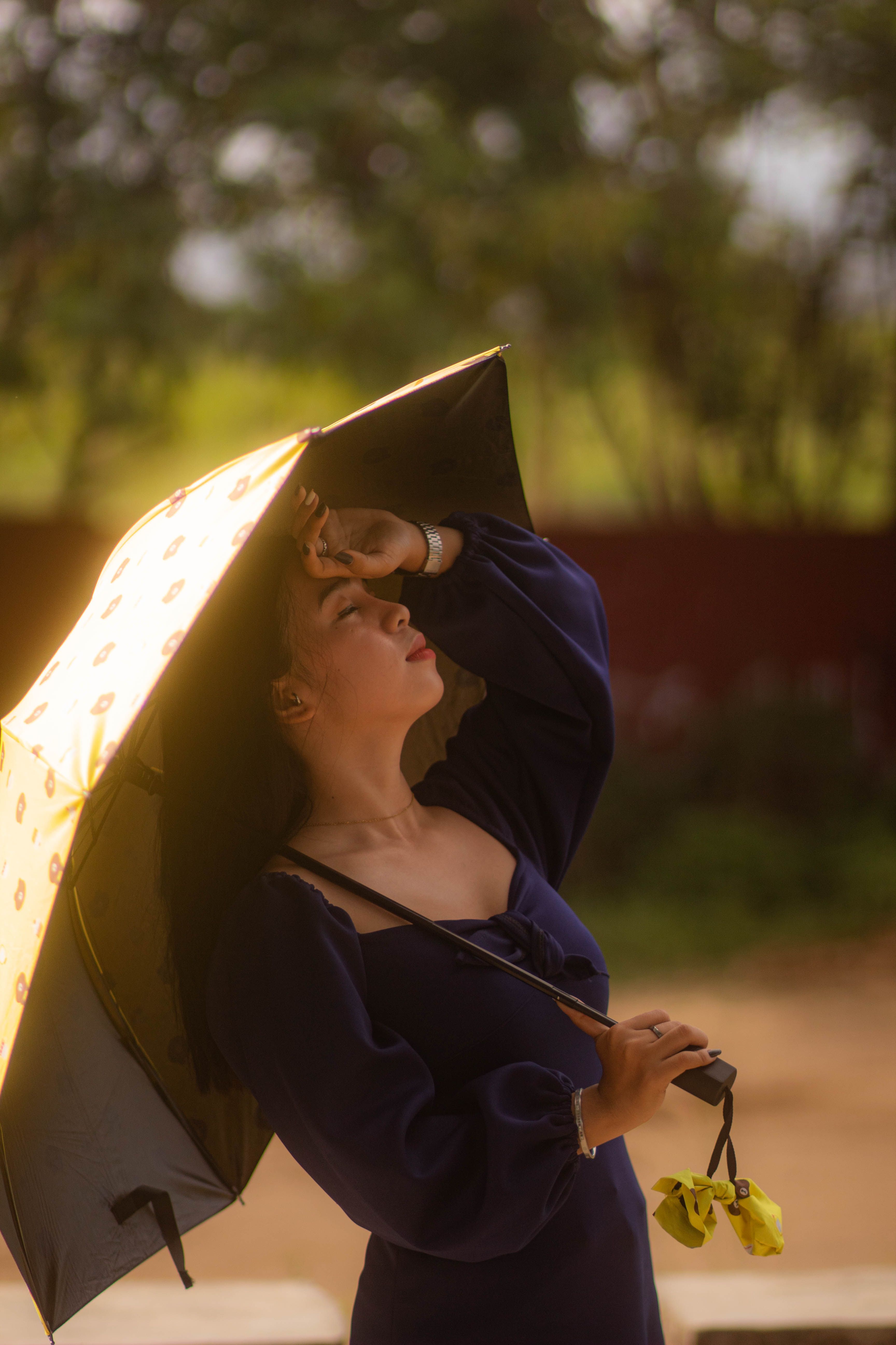 Photo of Woman Holding Black Umbrella · Free Stock Photo