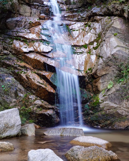 A Waterfalls Cascading on a Rock Formation