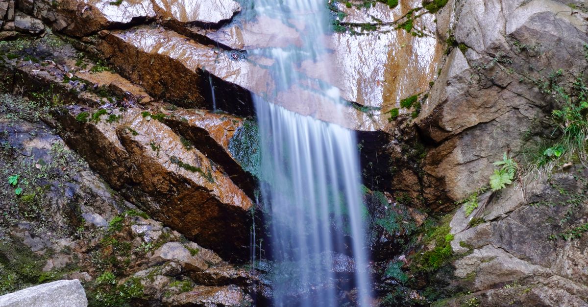 Waterfall And Rocks A Waterfalls Cascading on a Rock Formation · Free Stock Photo