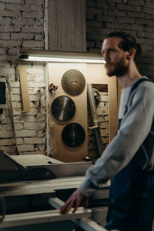 Man Among Saws in Carpentry 