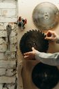 Person Holding Round Brass Metal