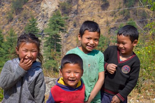 Free Group of happy children smiling outdoors in a rural setting. Captures innocence and joy. Stock Photo