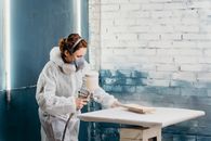 Woman in White Robe Holding White Ceramic Mug
