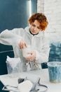 Woman in White Dress Shirt Holding White Ceramic Mug