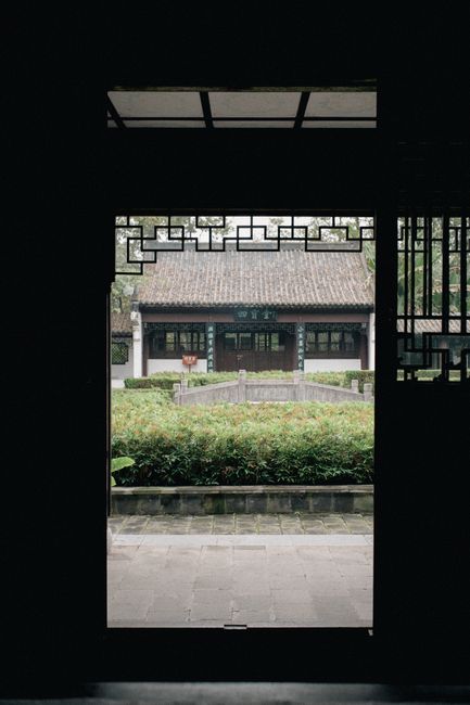 View of historical Chinese architecture through a wooden door in Yichang, Hubei, China.