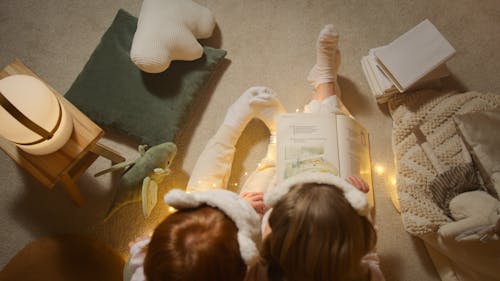 Free Overhead Shot of Kids Reading a Book Stock Photo
