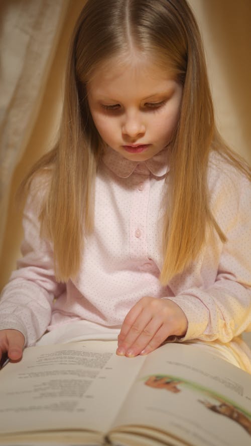 Free Photo of a Cute Child Reading a Book Stock Photo