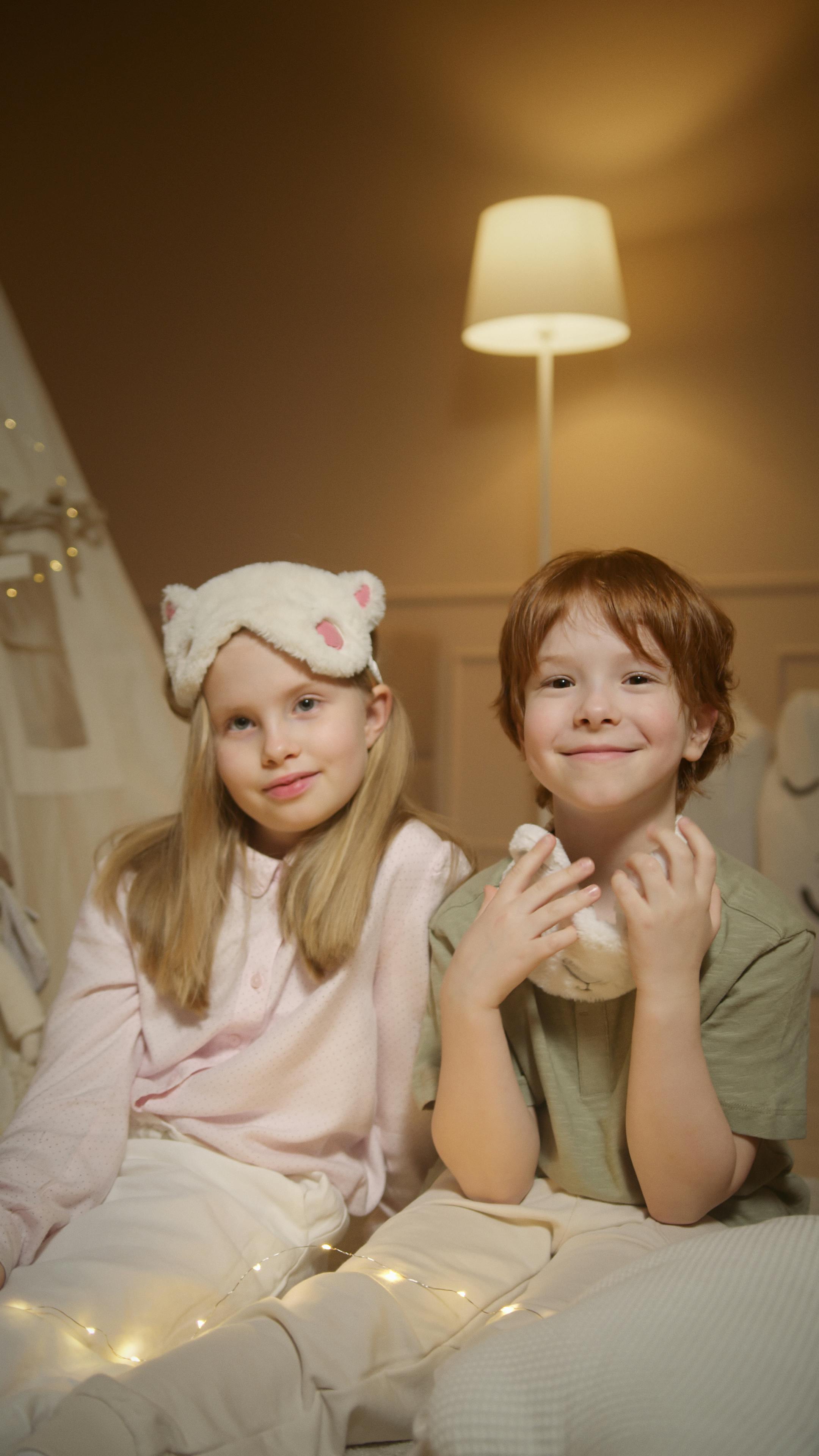 adorable siblings smiling before bedtime